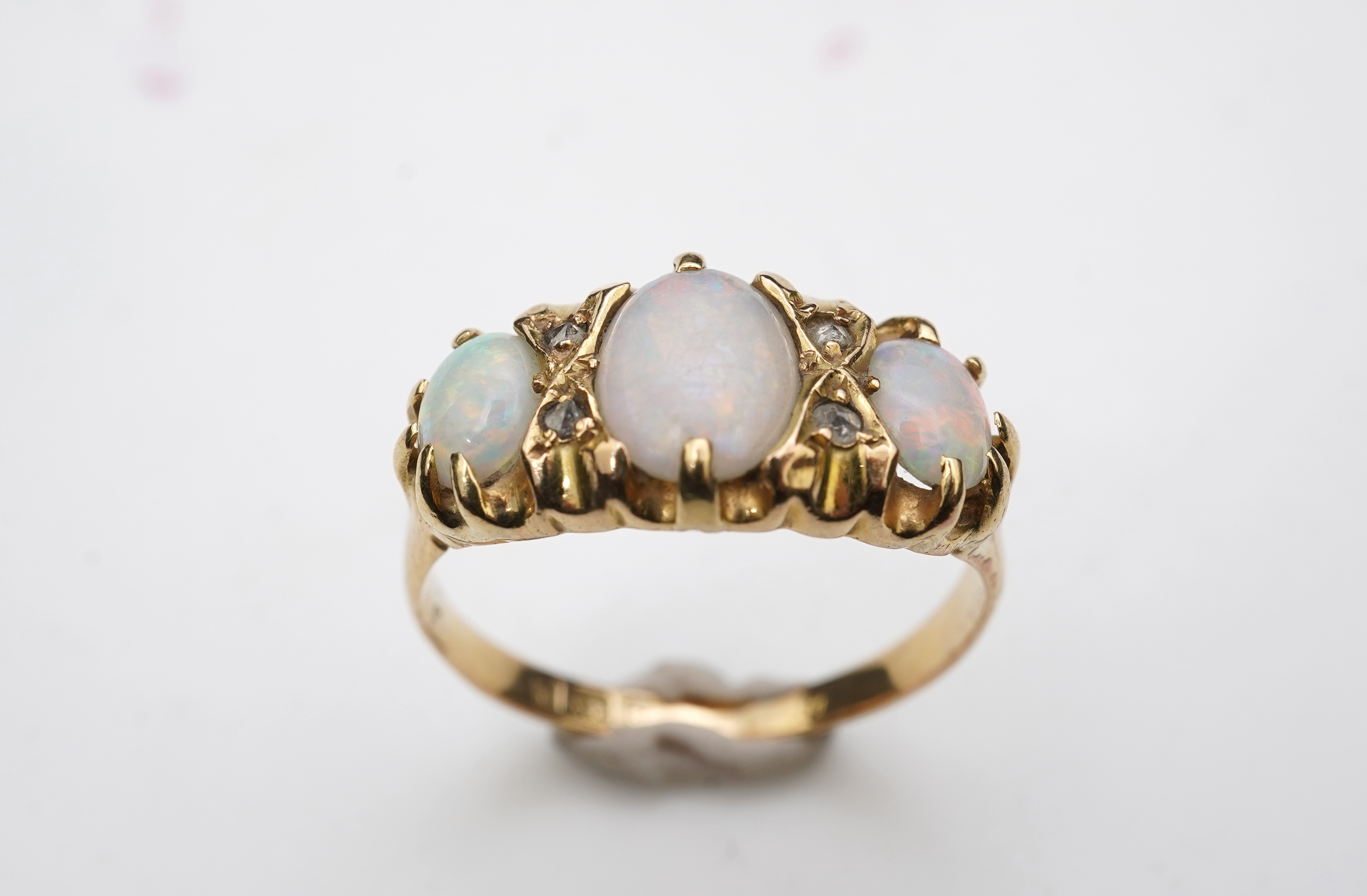 A Victorian 18ct gold and opal ring, circa 1898